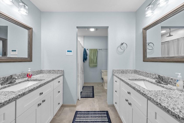 932 Scenic Loop, Kingsland, TX 78639 - full bathroom featuring two vanities and a shower with shower curtain