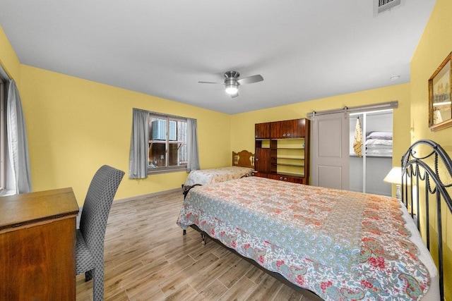 932 Scenic Loop, Kingsland, TX 78639 - bedroom with wood finished floors and ceiling fan