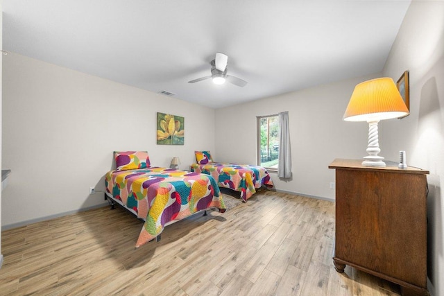 932 Scenic Loop, Kingsland, TX 78639 - bedroom with wood finished floors and a ceiling fan