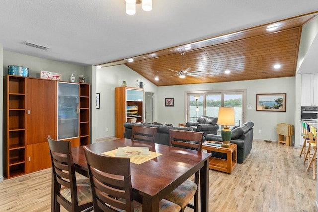 932 Scenic Loop, Kingsland, TX 78639 - dining area with light wood finished floors, vaulted ceiling, a ceiling fan, and recessed lighting