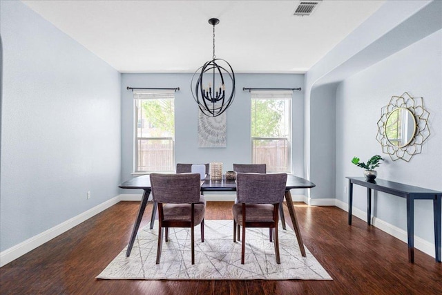 100 Matthews, Kyle, TX 78640 - dining area featuring a chandelier, baseboards, and wood finished floors