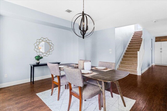 100 Matthews, Kyle, TX 78640 - dining room featuring a chandelier, wood finished floors, stairs, and baseboards