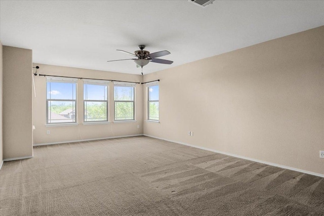 100 Matthews, Kyle, TX 78640 - carpeted spare room with baseboards and a ceiling fan