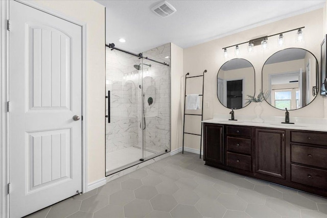 100 Matthews, Kyle, TX 78640 - full bathroom with a shower stall, double vanity, tile patterned floors, and baseboards