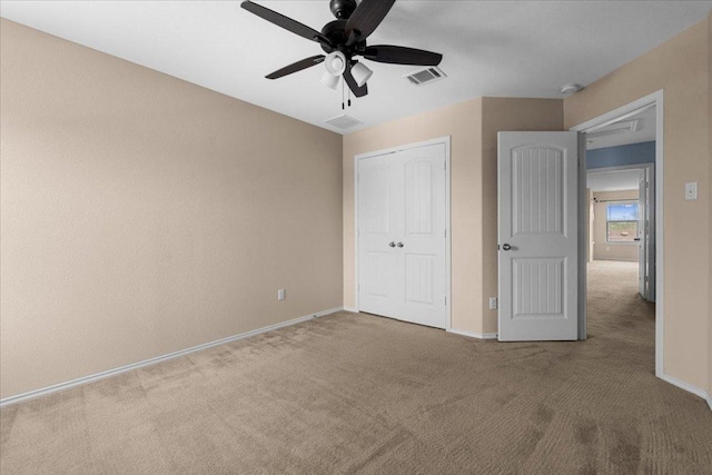 100 Matthews, Kyle, TX 78640 - unfurnished bedroom featuring carpet flooring, baseboards, a closet, and a ceiling fan