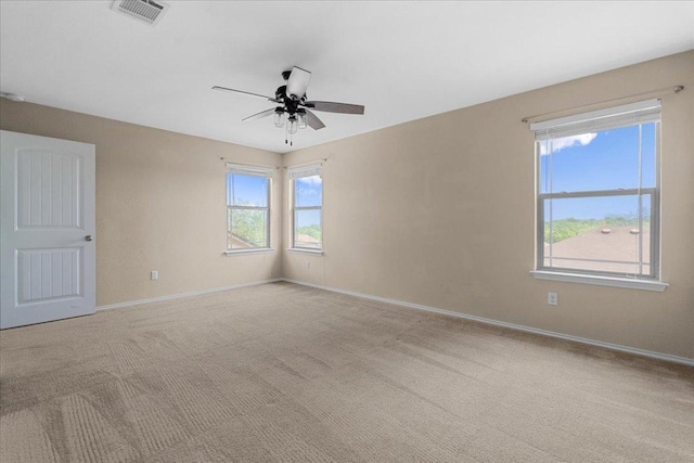 100 Matthews, Kyle, TX 78640 - unfurnished room with ceiling fan, baseboards, and carpet floors