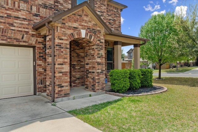 100 Matthews, Kyle, TX 78640 - doorway to property with brick siding, a garage, a yard, and concrete driveway