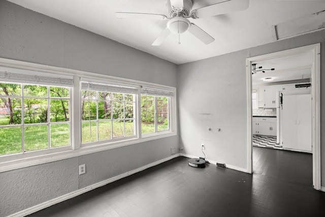 7202 Marcell St, Austin, TX 78752 - spare room featuring ceiling fan and a textured wall