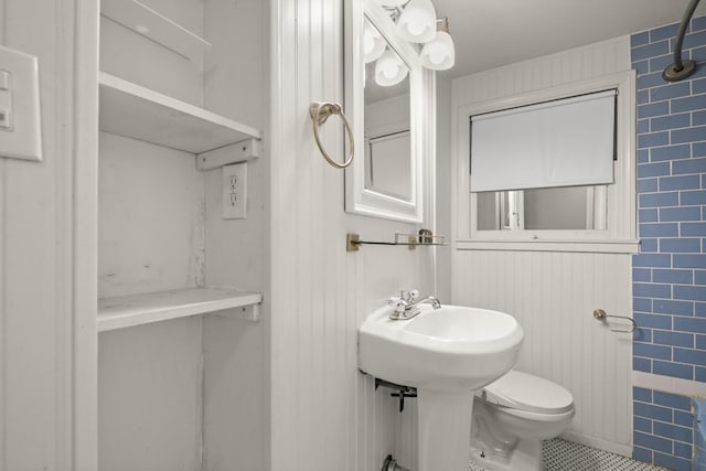 7202 Marcell St, Austin, TX 78752 - bathroom with toilet and tile patterned flooring