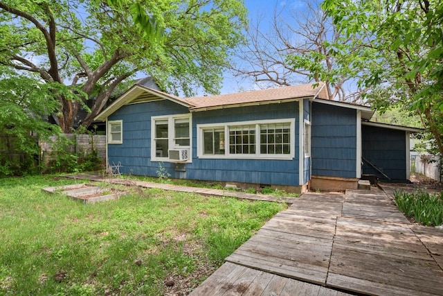 7202 Marcell St, Austin, TX 78752 - view of front facade with cooling unit and a vegetable garden