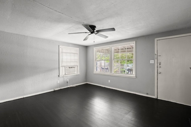7202 Marcell St, Austin, TX 78752 - unfurnished room with wood finished floors, a ceiling fan, a textured ceiling, and cooling unit