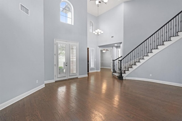 2015 Colina Cv, Cedar Park, TX 78613 - entryway with a ceiling fan, stairway, healthy amount of natural light, hardwood / wood-style floors, and a towering ceiling