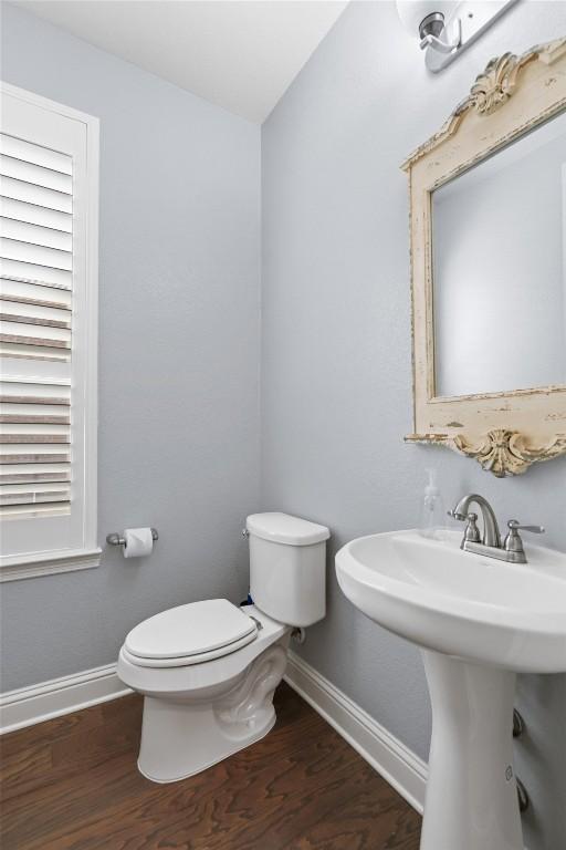 2015 Colina Cv, Cedar Park, TX 78613 - bathroom featuring wood finished floors and toilet