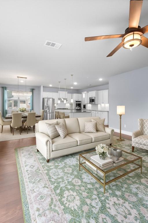 2015 Colina Cv, Cedar Park, TX 78613 - living area featuring a ceiling fan, recessed lighting, and wood finished floors