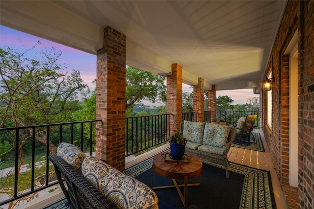 6605 Canon Wren Dr, Austin, TX 78746 - balcony at dusk with an outdoor living space
