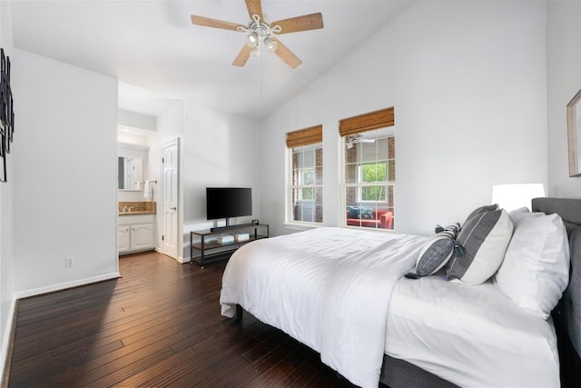 6605 Canon Wren Dr, Austin, TX 78746 - bedroom featuring dark wood finished floors, vaulted ceiling, baseboards, connected bathroom, and ceiling fan