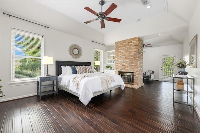 6605 Canon Wren Dr, Austin, TX 78746 - bedroom featuring baseboards, wood finished floors, a fireplace, a ceiling fan, and ornamental molding