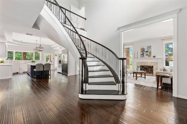 6605 Canon Wren Dr, Austin, TX 78746 - stairs with wood finished floors, plenty of natural light, and recessed lighting