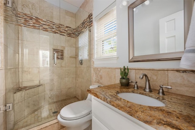 6605 Canon Wren Dr, Austin, TX 78746 - bathroom featuring vanity, a shower stall, toilet, and tile walls
