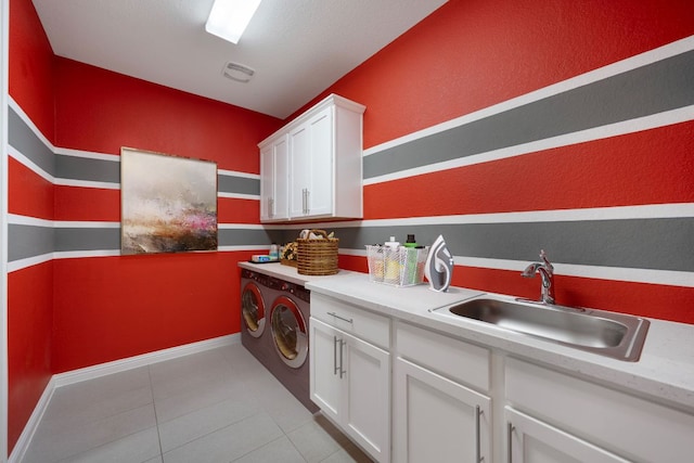 433 Chitalpa St, Leander, TX 78641 - washroom featuring independent washer and dryer, cabinet space, light tile patterned floors, and baseboards