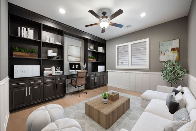 433 Chitalpa St, Leander, TX 78641 - home office with built in desk, ceiling fan, light wood-style flooring, wainscoting, and recessed lighting