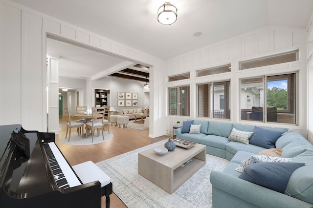 433 Chitalpa St, Leander, TX 78641 - living area featuring wood finished floors and beam ceiling
