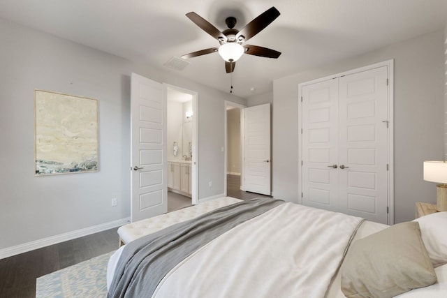 433 Chitalpa St, Leander, TX 78641 - bedroom featuring a closet, baseboards, wood finished floors, ceiling fan, and ensuite bathroom