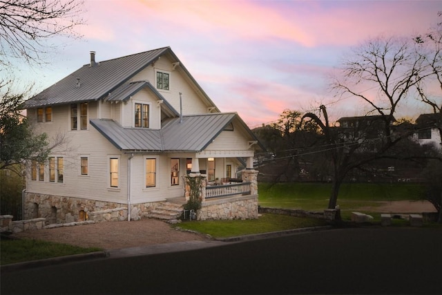 1313 W 9th 1/2 St, Austin, TX 78703 - view of front of property featuring covered porch, a metal roof, and a standing seam roof