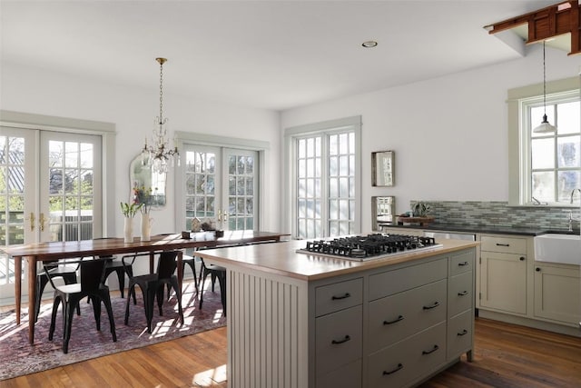 1313 W 9th 1/2 St, Austin, TX 78703 - kitchen featuring plenty of natural light, hardwood / wood-style floors, a center island, and recessed lighting