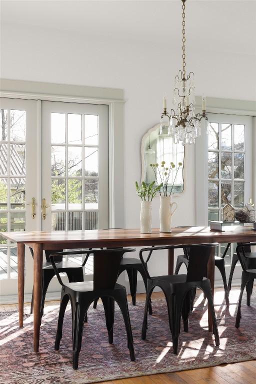 1313 W 9th 1/2 St, Austin, TX 78703 - dining area with healthy amount of natural light and a chandelier