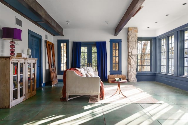 1313 W 9th 1/2 St, Austin, TX 78703 - living room featuring beamed ceiling and french doors