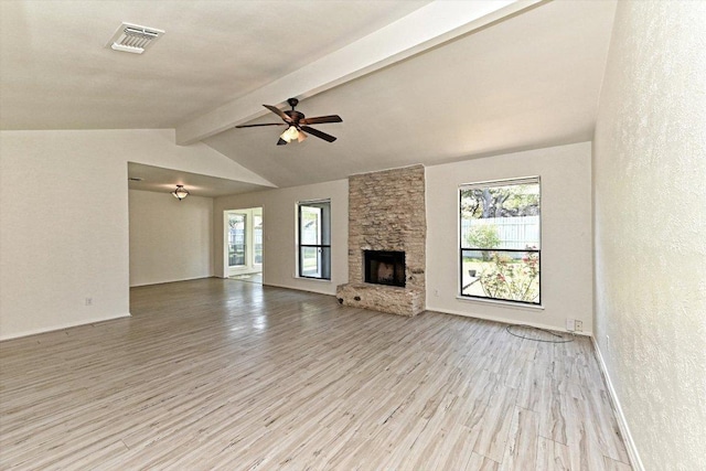 5003 Wing Rd, Austin, TX 78749 - unfurnished living room with wood finished floors, ceiling fan, a fireplace, a textured wall, and baseboards