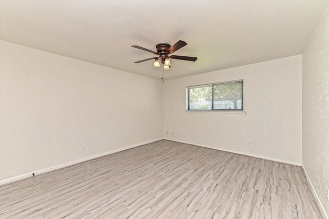 5003 Wing Rd, Austin, TX 78749 - empty room with light wood-type flooring, a ceiling fan, and baseboards