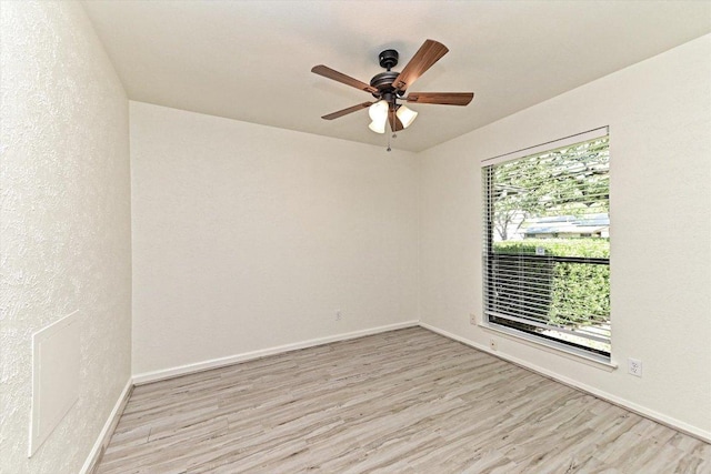 5003 Wing Rd, Austin, TX 78749 - unfurnished room with light wood finished floors, ceiling fan, and baseboards