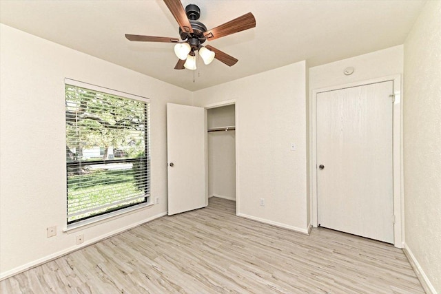 5003 Wing Rd, Austin, TX 78749 - unfurnished bedroom featuring light wood-style flooring, baseboards, ceiling fan, and a closet