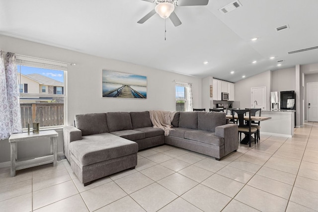 13801 Rosebud Isle Dr, Manor, TX 78653 - living area featuring light tile patterned flooring, ceiling fan, lofted ceiling, and recessed lighting