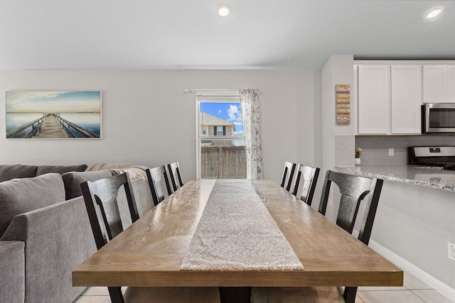 13801 Rosebud Isle Dr, Manor, TX 78653 - dining space featuring light tile patterned floors and recessed lighting