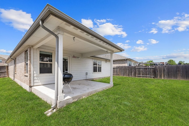 13801 Rosebud Isle Dr, Manor, TX 78653 - back of property featuring a patio area and brick siding