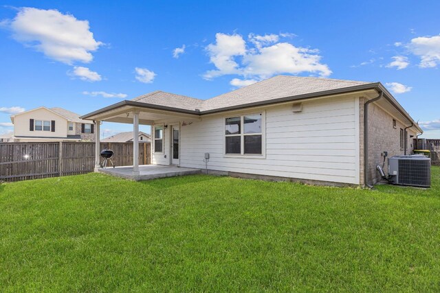 13801 Rosebud Isle Dr, Manor, TX 78653 - rear view of house featuring a patio and central AC unit