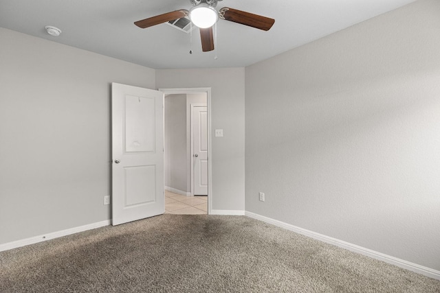 13801 Rosebud Isle Dr, Manor, TX 78653 - empty room with a ceiling fan, light colored carpet, and baseboards