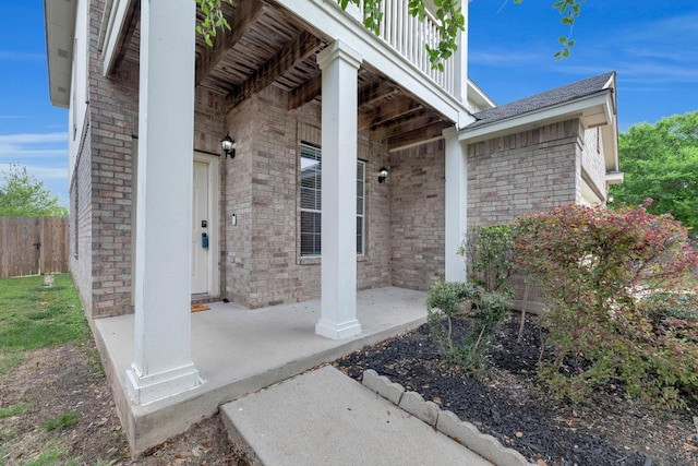 13605 Lyndon B Johnson St, Manor, TX 78653 - doorway to property featuring brick siding and covered porch