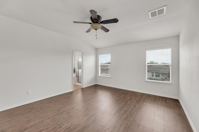 13605 Lyndon B Johnson St, Manor, TX 78653 - spare room featuring dark wood-style floors, baseboards, a ceiling fan, and lofted ceiling