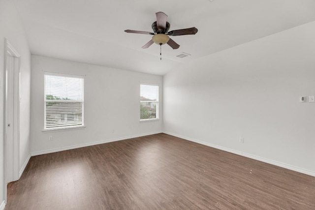 13605 Lyndon B Johnson St, Manor, TX 78653 - unfurnished room with wood finished floors, ceiling fan, baseboards, and lofted ceiling