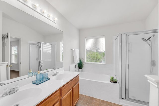13605 Lyndon B Johnson St, Manor, TX 78653 - full bathroom with a stall shower, a bath, plenty of natural light, and double vanity