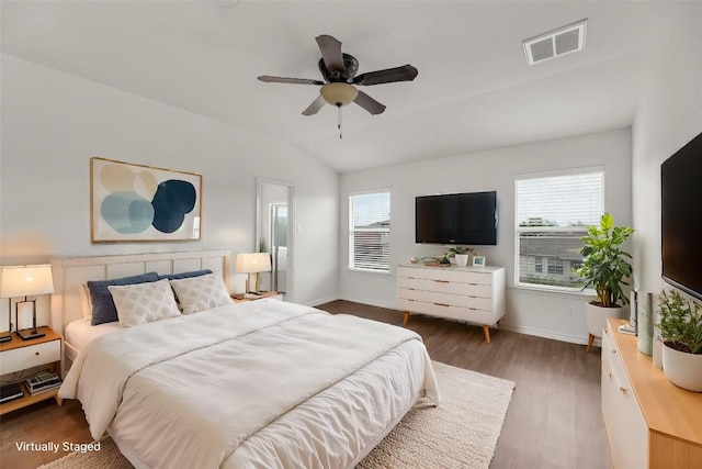 13605 Lyndon B Johnson St, Manor, TX 78653 - bedroom featuring wood finished floors, baseboards, lofted ceiling, and ceiling fan