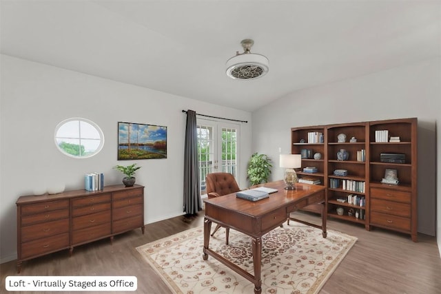 13605 Lyndon B Johnson St, Manor, TX 78653 - home office with vaulted ceiling, wood finished floors, and baseboards