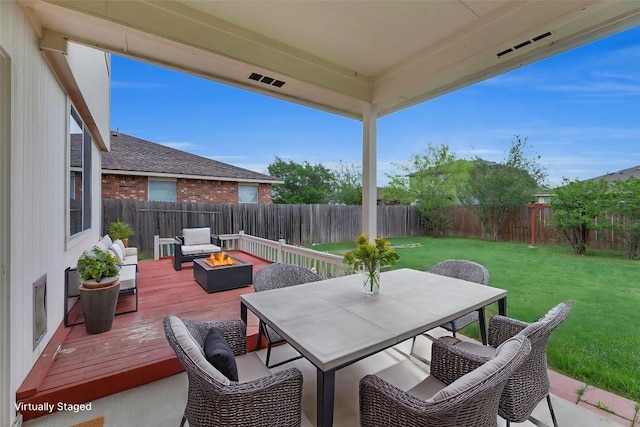 13605 Lyndon B Johnson St, Manor, TX 78653 - view of patio / terrace featuring outdoor dining space, a deck, and an outdoor fire pit
