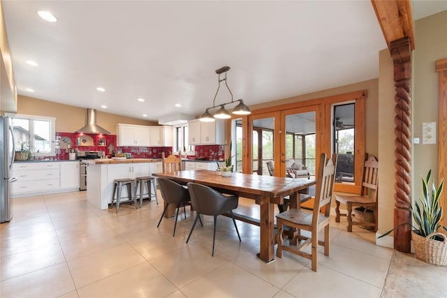 dining room with recessed lighting and french doors