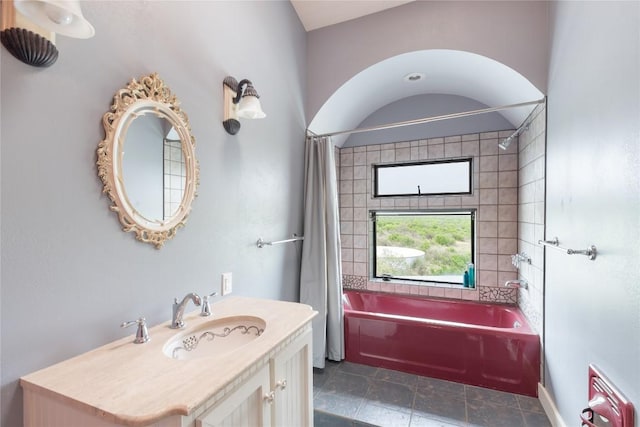 bathroom with shower / tub combo and vanity