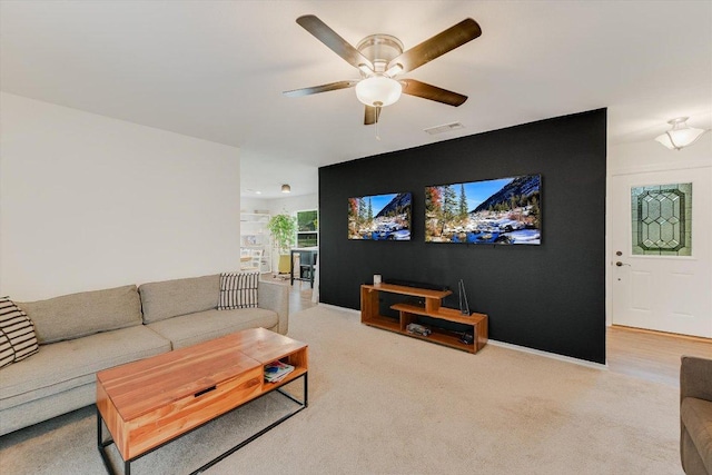 9106 Slayton Dr, Austin, TX 78753 - carpeted living room with ceiling fan and baseboards